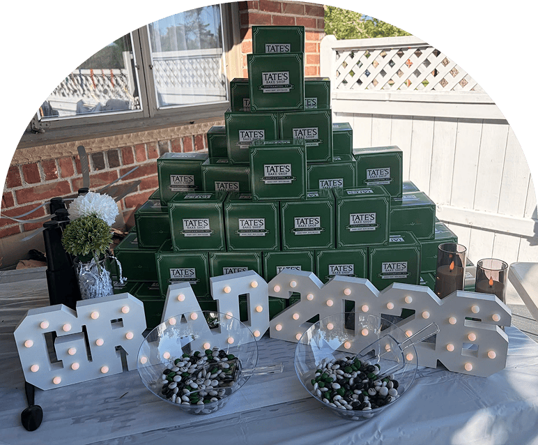Graduation table display with decorative treats.