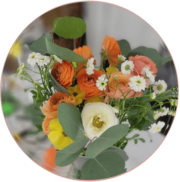 Colorful floral arrangement with greenery accents.