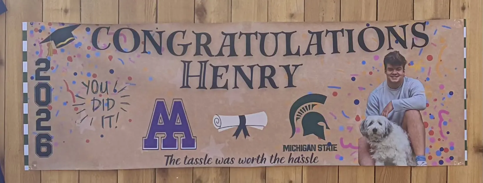Graduation banner celebrating Henry's achievement.