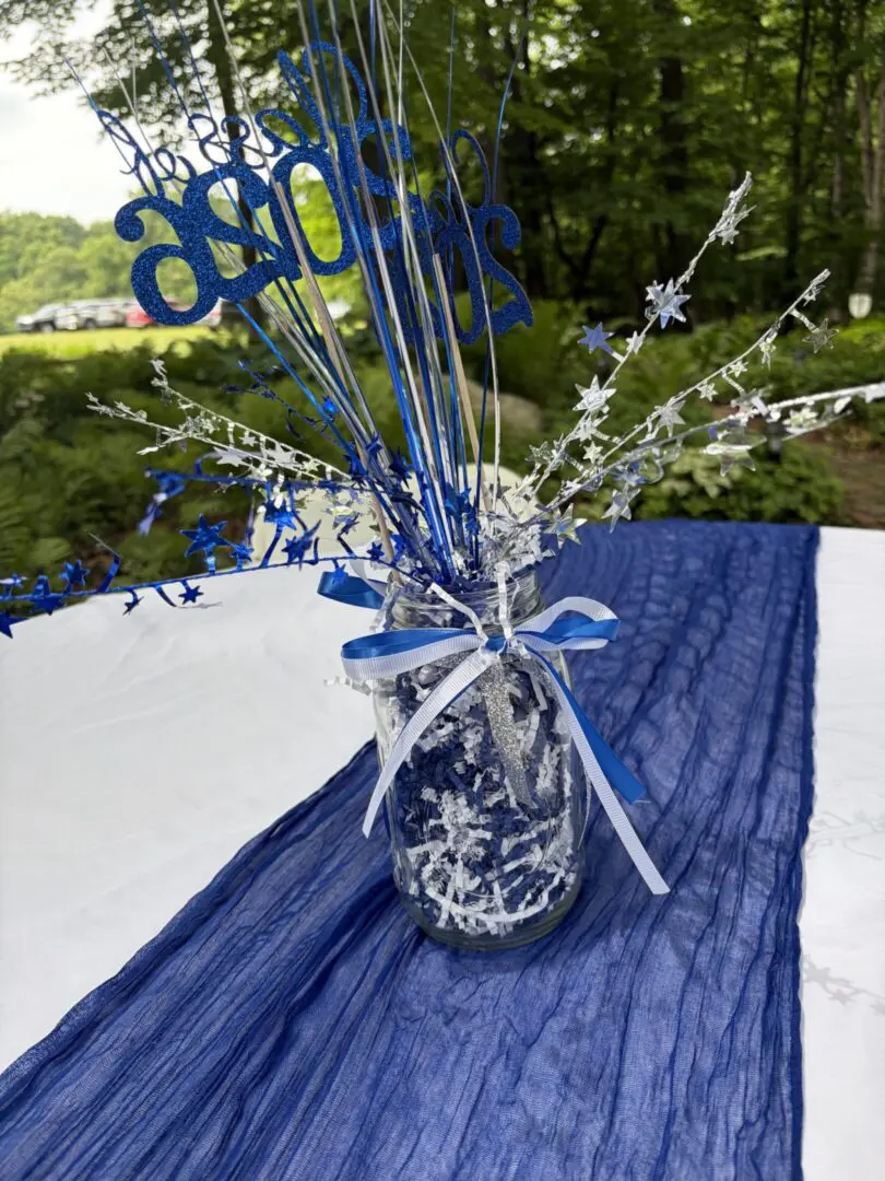 Blue-themed centerpiece with decorative stars and ribbons.