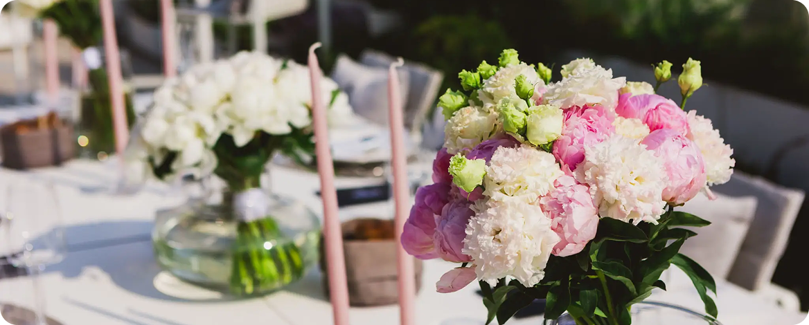 Vibrant floral centerpiece with pink and white blooms.