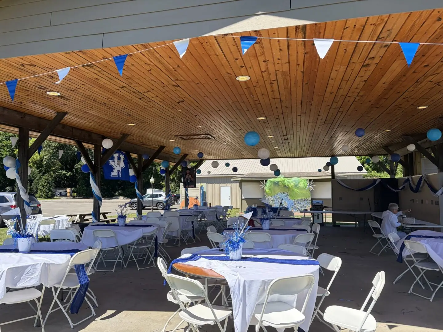 Festive outdoor event space with blue decorations.