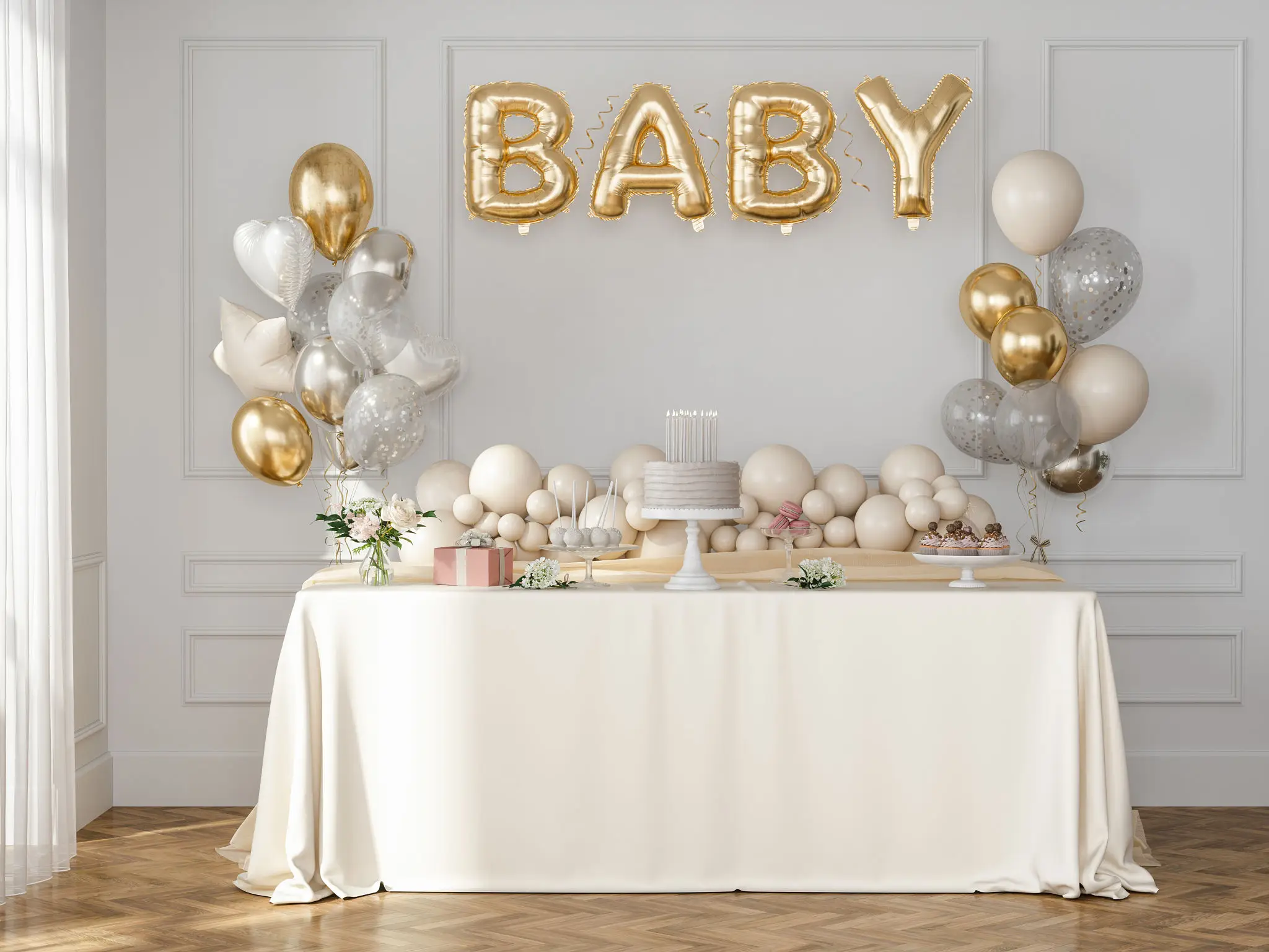 Baby-themed celebration table with elegant decor.