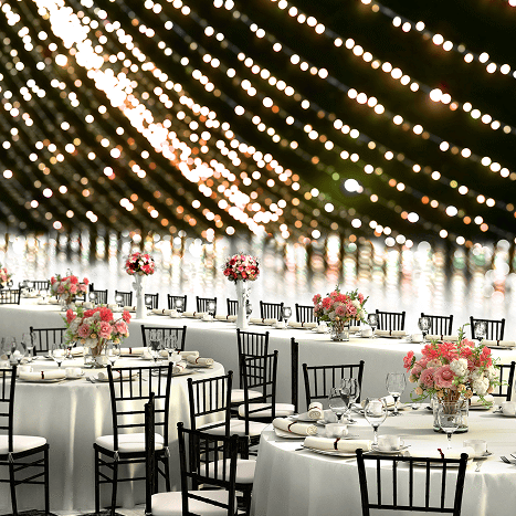 Elegant wedding reception with string lights.